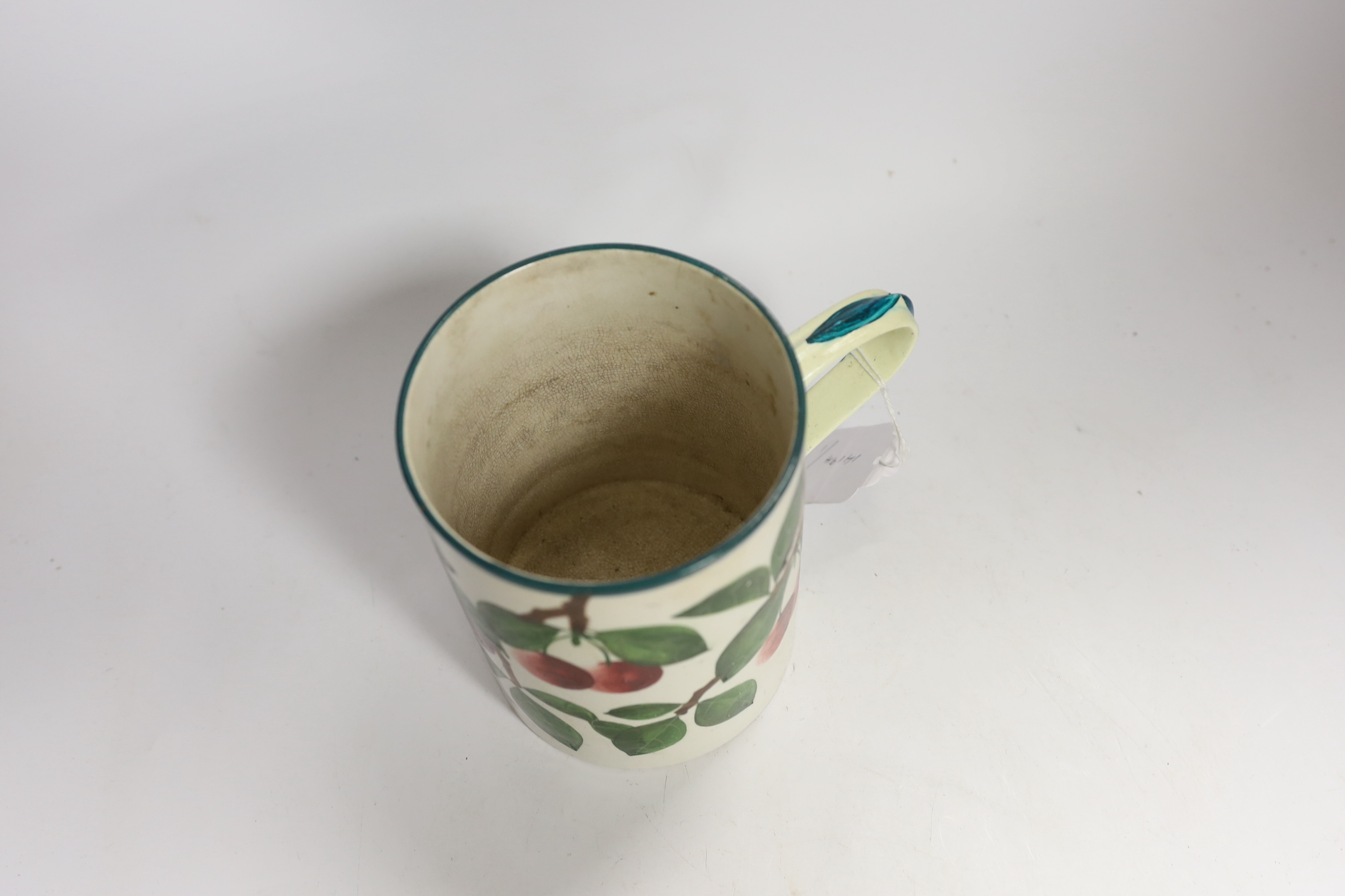 A Wemyss mug with cherry decoration (restored a.f.), 14cm high